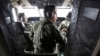 Pilots of a Royal Malaysian Air Force CN-235 aircraft manage their plane during a search and rescue operation for the missing Malaysia Airlines plane over the waters at Malacca straits, Malaysia, March 13, 2014. 