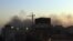 Smoke rises over central Khartoum as cars burn during demonstrations over the deaths of four students from war-torn Darfur, December 9, 2012.