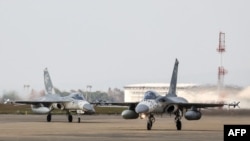 Taiwanese air force fighter jets taxi for take-off during at the Ching Chuan Kang Air Base in Taichung on Jan. 7, 2025. Taiwan dispatched forces on February 26, 2025, in response to "live-fire" drills conducted by China, Taipei's defense ministry said.