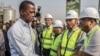FILE - Zambian President Edgar Lungu, left, greets Chinese workers from Aviation Industry Corporation of China during a walk on a major road in Lusaka, Zambia, Sept. 15, 2018. 