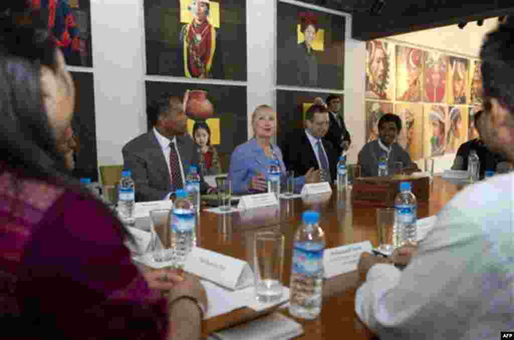 U.S. Secretary of State Hillary Rodham Clinton, center, meets with ethnic minority representatives at the Beik Thano Gallery in Yangon, Myanmar, Friday, Dec. 2, 2011. U.S. Secretary of State Clinton and Myanmar opposition leader Aung San Suu Kyi, two of