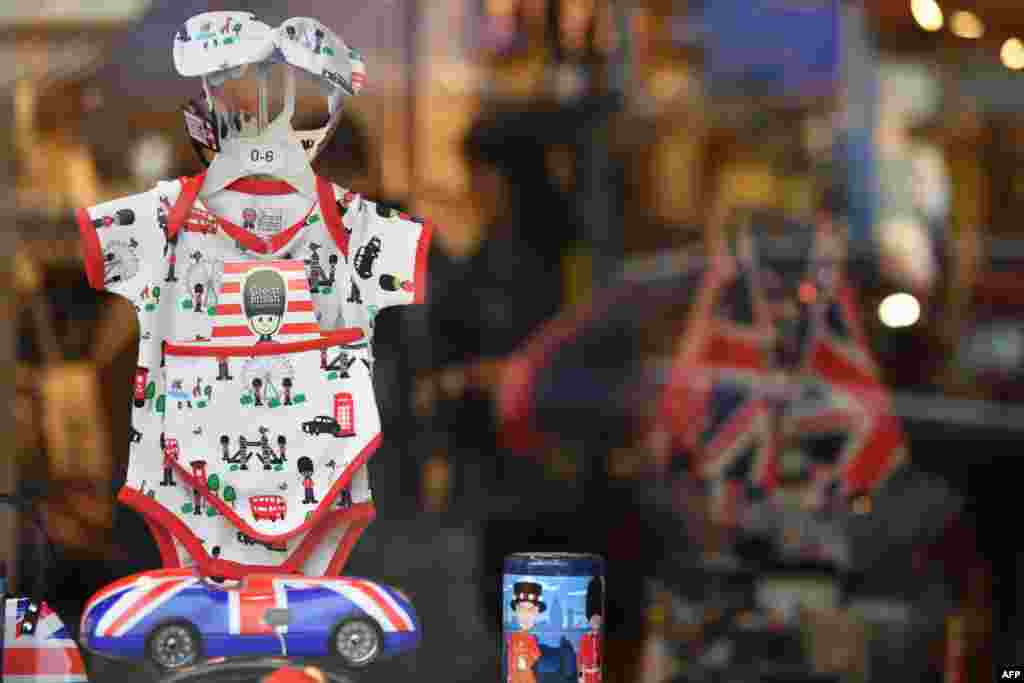 Souvenirs are seen on display in a shop window in Windsor as excitement builds ahead of the birth of the child of Britain&#39;s Prince Harry and Meghan, Duke and Duchess of Sussex.