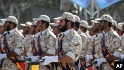 FILE - Members of Iran's Islamic Revolutionary Guard Corps march just outside Tehran during an armed forces parade, Sept. 22, 2011. The elite Quds Force represents one of eight branches of the IRGC.