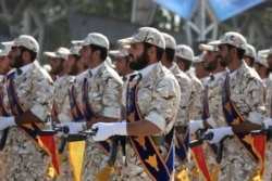 FILE - Members of Iran's Islamic Revolutionary Guard Corps march just outside Tehran during an armed forces parade, Sept. 22, 2011.