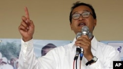 Sam Rainsy, leader of Cambodia's opposition Sam Rainsy Party, speaks during a campaign rally in Kandal province in 2008.