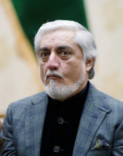 Afghanistan's presidential candidate Abdullah Abdullah arrives for a news conference after the preliminary presidential election results in Kabul, Afghanistan, Dec. 22, 2019.