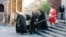 The coffin of Archbishop Emeritus Desmond Tutu is carried from St. George's Cathedral where he laid in state in Cape Town, South Africa, Dec. 30, 2021. 