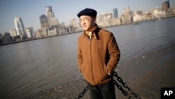 Chinese-born U.S. scientist Hu Zhicheng stands at the waterfront promenade along the Huangpu River in Shanghai, China, January 2013.
