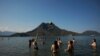 People enjoy the good weather, sea and sun in Adrasan on Turkey's Mediterranean, June 19, 2021.