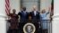 First lady Jill Biden and President Joe Biden, along with Kenya's President William Ruto and his wife Rachel Ruto, wave from the Blue Room Balcony during a State Arrival Ceremony on the South Lawn of the White House, May 23, 2024, in Washington.