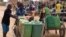 Displaced children that fled from their villages in northern Burkina Faso, following attacks by assailants, push carts loaded with water containers at a school on the outskirts of Ouagadougou, June 15, 2019.