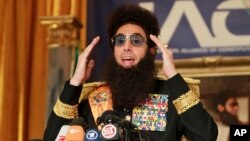 Sasha Baron Cohen, dressed as his alter-ego Admiral General Aladeen from his upcoming film, "The Dictator," speaks during a news conference, Monday, May 7, 2012, at The Waldorf Astoria Hotel in New York. 