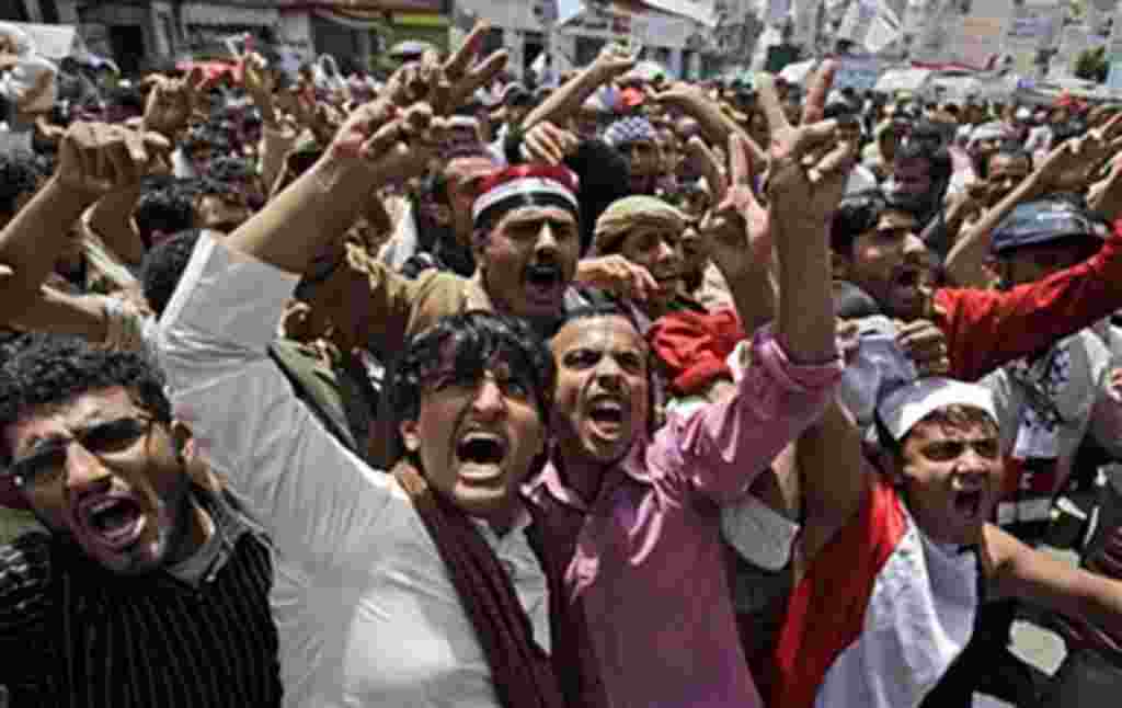 Anti-government protesters shout slogans during a demonstration demanding the resignation of Yemeni President Ali Abdullah Saleh, in Sana'a, May 7, 2011