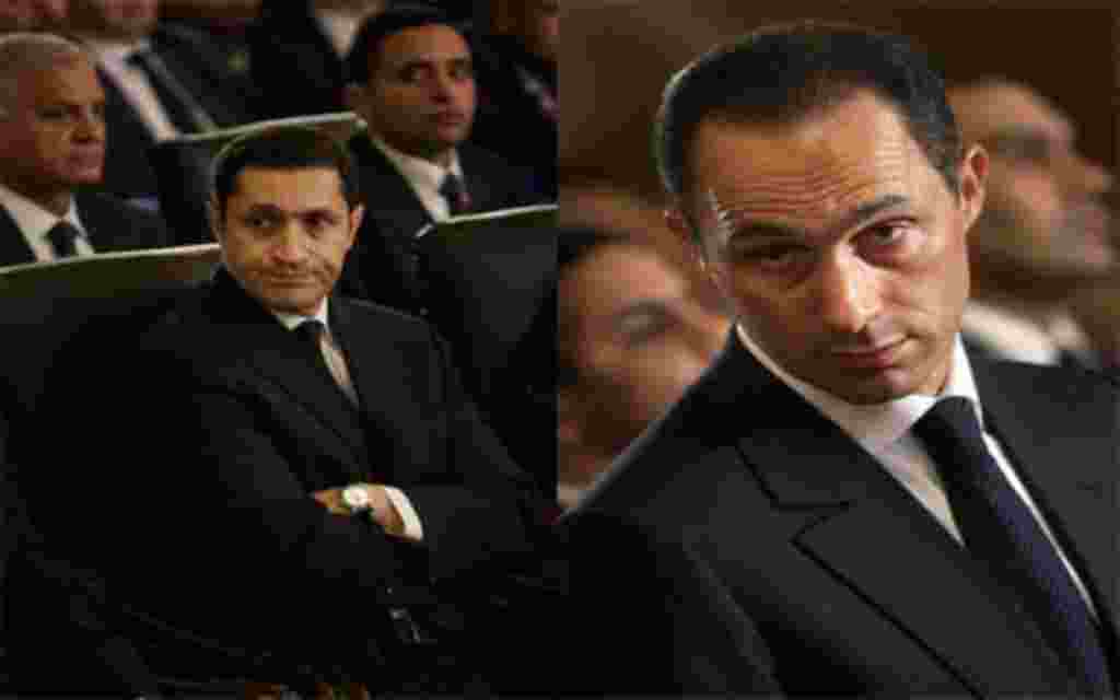 FILE - A Jan. 6, 2011, file photo shows Gamal and Alaa Mubarak, son of Egyptian President Hosni Mubarak, at the Christmas Eve Mass at the Coptic cathedral in Cairo, Egypt. Egyptian authorities took Gamal Mubarek and his brother Alaa into custody Wednesday