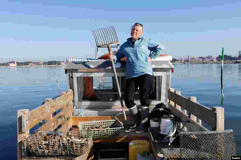 Valerie Perron, 53, an oyster farmer, poses for a photograph on her boat in Andernos, Southwestern France, Feb. 17, 2017. &quot;It must not be forgotten that it is women, moms, who raise the boys. It is therefore up to us to change the mentalities by raising the boys at their youngest age, in a spirit of parity and equality with the woman. We must change the mentalities of early childhood education. A boy can play with dolls and a little girl with small cars,&quot; Perron said.