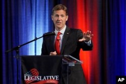 FILE - Sen. Ben Sasse, R-Neb., speaks during a legislative summit sponsored by the Omaha and Lincoln Chambers of Commerce, which was held at the Strategic Air Command &amp; Aerospace Museum in Ashland, Nebraska, Aug. 8, 2019.