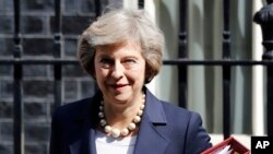 FILE- Britain's Prime Minister Theresa May leaves 10 Downing Street in London, July 20, 2016. ﻿