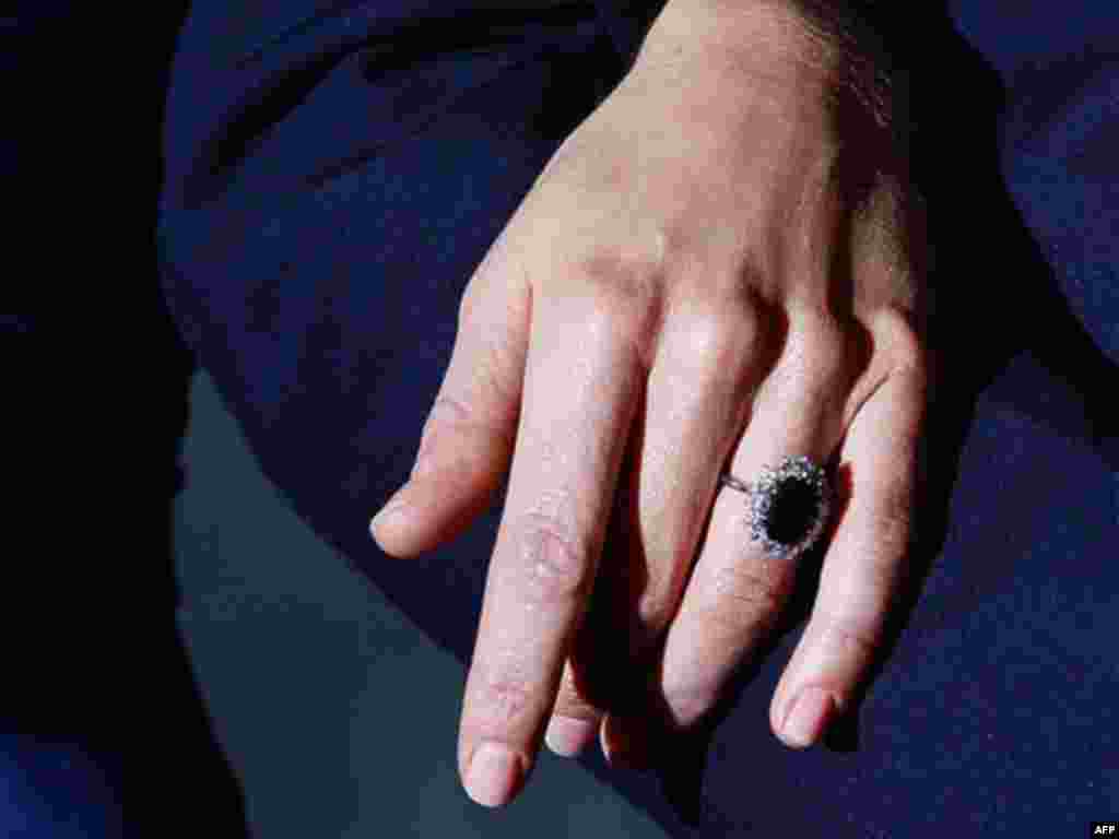 Kate Middleton wears the engagement ring of Diana, Princess of Wales, as she poses for the media with Britain's Prince William following the announcement of their engagement, at St. James's Palace in London. (AP Photo/Kirsty Wigglesworth)