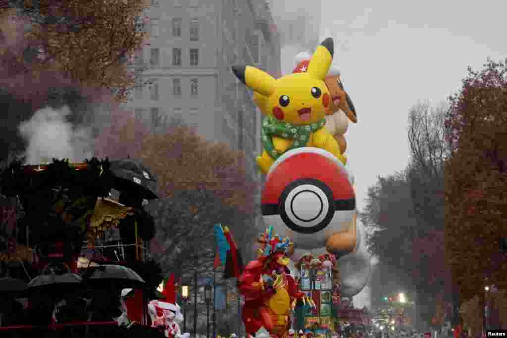 Pikachu and Eevee balloon flies during the Macy&#39;s Thanksgiving Day Parade in New York City, Nov. 28, 2024.