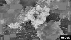 This video grab shows a coalition airstrike destroying Islamic State militant group's finance distribution center near Mosul, Iraq, Jan. 11, 2016. The Pentagon has released several videos in recent weeks that U.S. officials say, show coalition aircraft bombing IS cash depots in Mosul, Iraq and nearby city of Ninevah.