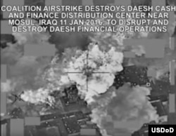 This video grab shows a coalition airstrike destroying Islamic State militant group's finance distribution center near Mosul, Iraq, Jan. 11, 2016.