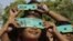 Indian children use cardboard eclipse glasses as they prepare to watch the transit of Venus in Allahabad, India, June 5, 2012.