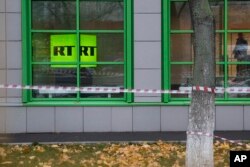 The logo of Russian state-owned television channel RT is seen on a window of the company's office in Moscow, Russia, Oct. 27, 2017.