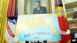 A map featuring the words "Gulf of America" is seen in the Oval Office during an event with President Donald Trump at the White House on Feb. 11, 2025, in Washington.