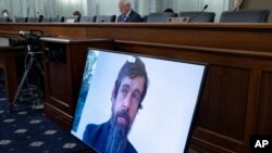 Twitter CEO Jack Dorsey appears on a screen as he speaks remotely during a hearing before the Senate Commerce Committee on Capitol Hill, Oct. 28, 2020, in Washington.