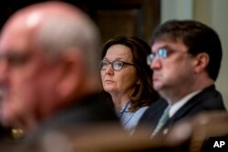 CIA Director Gina Haspel, center, attends a cabinet meeting in the Cabinet Room of the White House, Thursday, Aug. 16, 2018, in Washington.