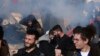 Greek Riot Police Fire Tear Gas at Protesters   