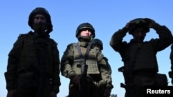 Recruits undergo combat assault training under the supervision of officers of Russia's Southern Military District, at a firing range in the Rostov region, Russia, Oct. 4, 2024.