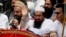 Hafiz Saeed, leader of a Pakistani religious group, center, waves during an anti-Indian rally in Lahore, July 19, 2016. Afghanistan has alleged for the first time that Saeed is overseeing attacks by Islamic State fighters in the war-torn country.