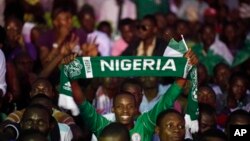 Nigeria soccer fans celebrate after Nigeria's Sunday Mba scored a goal against Burkina Faso during their African Cup of Nations final match in Lagos, Nigeria, Sunday, Feb. 10, 2013. Nigeria erupted in celebrations after their Super Eagles won the Africa