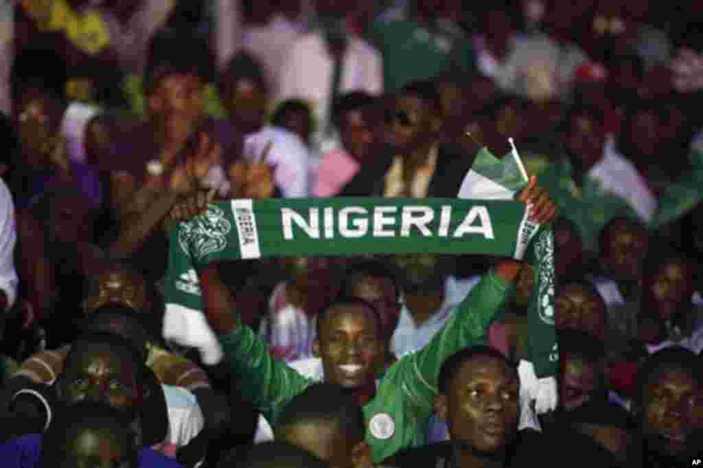 Nigeria soccer fans celebrate after Nigeria's Sunday Mba scored a goal against Burkina Faso during their African Cup of Nations final match in Lagos, Nigeria, Sunday, Feb. 10, 2013. Nigeria erupted in celebrations after their Super Eagles won the Africa