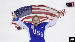 Jocelyne Lamoureux-Davidson of the United States celebrates after winning the women's gold medal hockey game at the 2018 Winter Olympics in Gangneung, South Korea, Feb. 22, 2018.