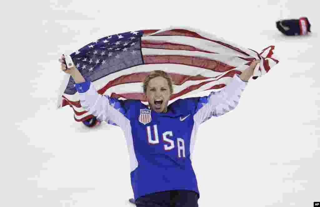 Jocelyne Lamoureux-Davidson of the United States celebrates after winning the women's gold medal hockey game at the 2018 Winter Olympics in Gangneung, South Korea, Feb. 22, 2018.