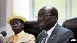 South Sudan's Foreign Minister Barnaba Marial Benjamin speaks during a press conference with Interior minister Aleu Ayienyi Aleu (L), in Juba, South Sudan, April 18, 2014. The Government of South Sudan strongly condemns the attack on innocent civilians in
