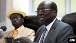 South Sudan's Foreign Minister Barnaba Marial Benjamin speaks during a press conference with Interior minister Aleu Ayienyi Aleu (L), in Juba, South Sudan, April 18, 2014. The Government of South Sudan strongly condemns the attack on innocent civilians in