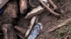 FILE — Shoes are seen after floodwater washed away houses and people, in Kamuchiri Village Mai Mahiu, Nakuru County, Kenya, on April 30, 2024.