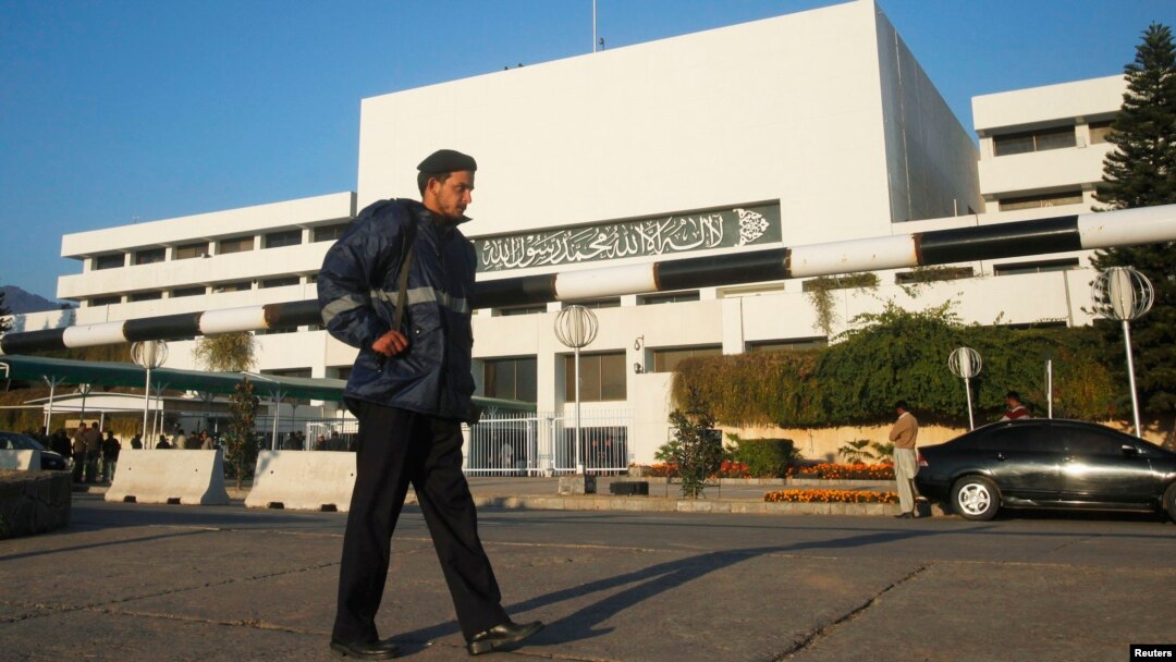 A policeman patrols in front of a parliament building during a session of the national assembly in Islamabad. (File)