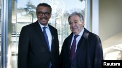 FILE - Director General of the World Health Organization (WHO) Tedros Adhanom Ghebreyesus, left, welcomes U.N. Secretary General Antonio Guterres at WHO headquarters in Geneva, Switzerland, Feb. 24, 2020. 