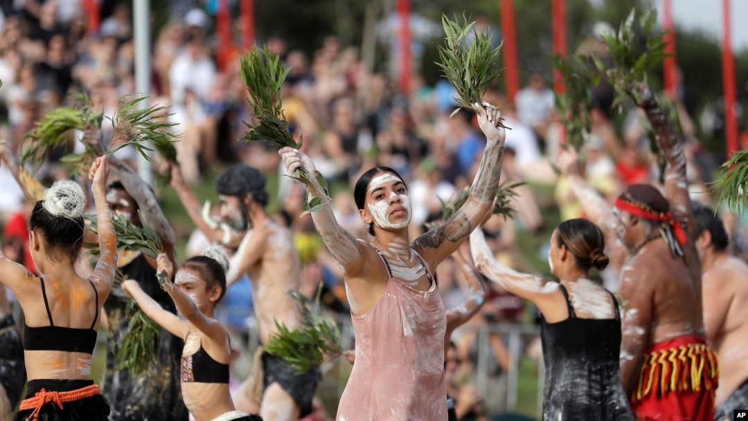 FILE - Jordan O'Davis, center, who is Aboriginal, performs with the Buja Buja dance troupe during the Wugulora Indigenous Morning Ceremony as part of Australia Day celebrations in Sydney, Australia, Jan. 26, 2020. 