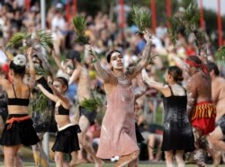 FILE - An Aboriginal dance troupe performs at Australia Day celebrations in Sydney, Australia, Jan. 26, 2020. Rap music has been employed as part of a new awareness campaign to educate Australia's Indigenous about the coronavirus.