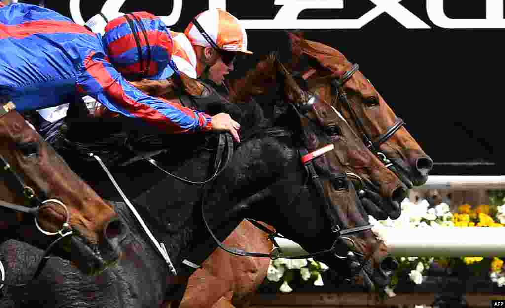 Jockey Craig Williams (R) onboard Vow and Declare wins the Melbourne Cup horse race in Melbourne, Australia.