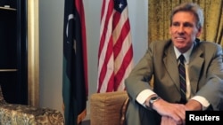 FILE - Ambassador Christopher Stevens is pictured at his residence in Tripoli, Libya, June 28, 2012. 