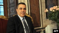 FILE - A picture taken on December 18, 2013, in Tunis shows newly-appointed Prime Minister Mehdi Jomaa waiting for a meeting at the Tunisian Constituent Assembly.