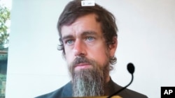 FILE - Twitter CEO Jack Dorsey appears on a screen as he speaks remotely during a hearing before the Senate Commerce Committee on Capitol Hill, Oct. 28, 2020, in Washington. 