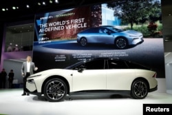 Xiaopeng He, Chairman and CEO of XPeng, speaks next to the Xpeng P7+ car during a press conference on media day at the 2024 Paris Auto Show in Paris, France, Oct. 14, 2024.