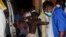 A badly burned child arrives at the Provincial Hospital in Tete, Mozambique, Nov. 17, 2016, after a truck carrying petrol burst into flames.